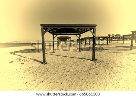 Sunshade on the Beach of Mediterranean Sea in Israel. Vintage Style Toned Picture