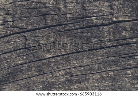 Slice of a wooden board of gark color, horizontal background