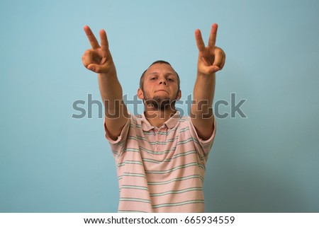 man shows two fingers