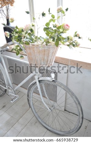 Vintage Bicycle with basket of flowers.A hand made flower on bicycle and light.