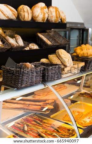 Modern spanish  bakery with different kinds of bread, cakes and buns  