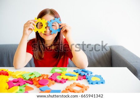 Girl playing with puzzle