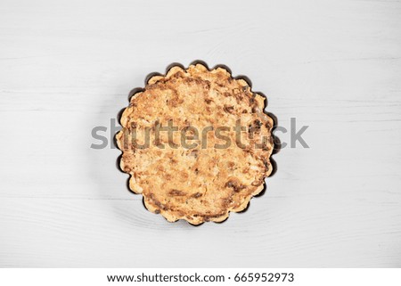 Delicious sour cream pie on a wooden light background