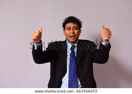 Exiting businessman thumbs-up on isolated background