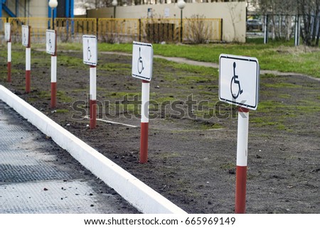 A number of parking signs, road signs in white and red stripes. Invalid places. Composition from white, blue, red, yellow, gray colors.