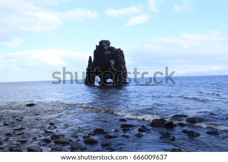 Rock formation in the fjord of an ocean, Iceland