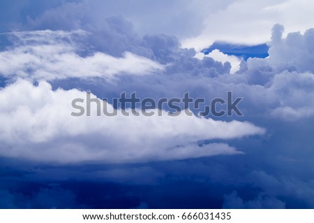 Deep blue cloudy sky. White clouds. Color photo. 