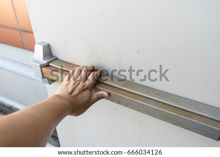 hand push the door for escape fire