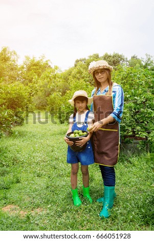 Mother and daughter  in the garden