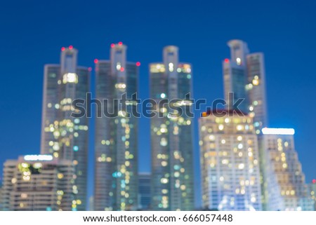 Twilight blurred bokeh office building light night view, abstract background