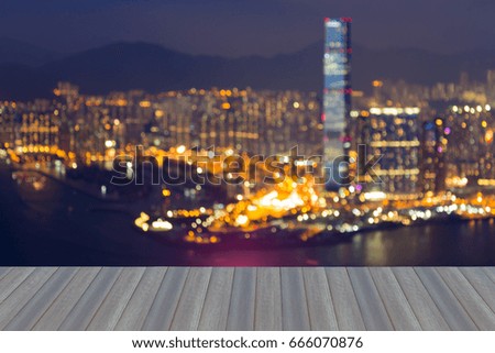 Opening wooden floor, Night blurred bokeh Hong Kong city downtown, abstract background