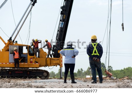 Heavy technicians and repair engineers work in teams on construction sites.