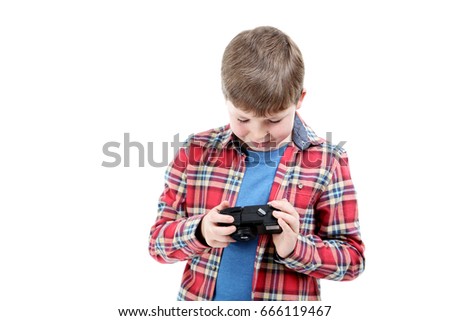 Young boy with camera on a white background