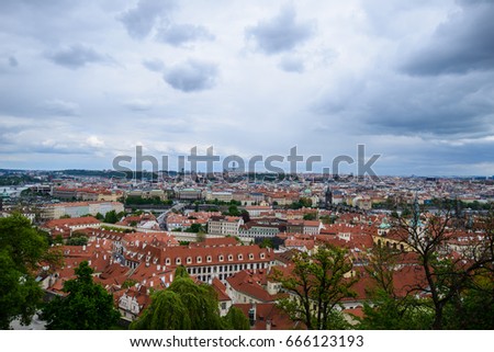 Aerial view of the colorful orange roofs of old houses in the city of Europe Prague.