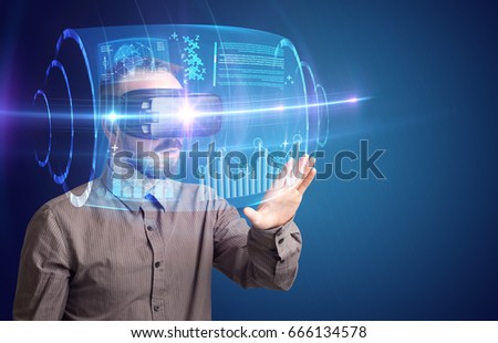 Amazed businessman with high tech 3D projection in front of him 
