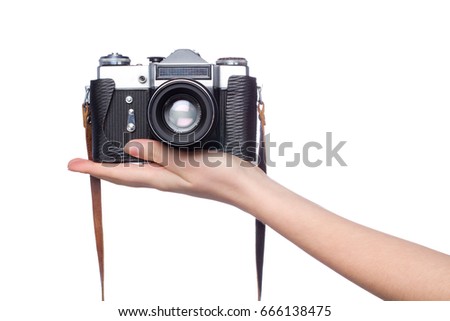 old camera on woman hand over white background