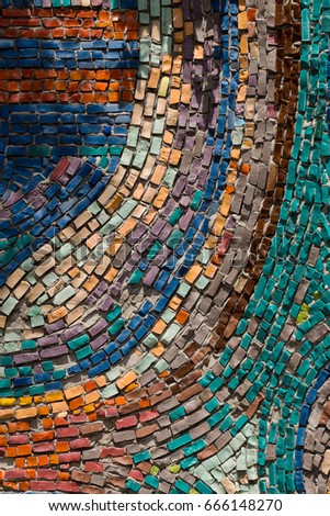 Detail of beautiful old collapsing abstract ceramic mosaic adorned building. Venetian mosaic as decorative background. Selective focus. Abstract Mosaic Pattern. Abstract mosaic colored  ceramic stones