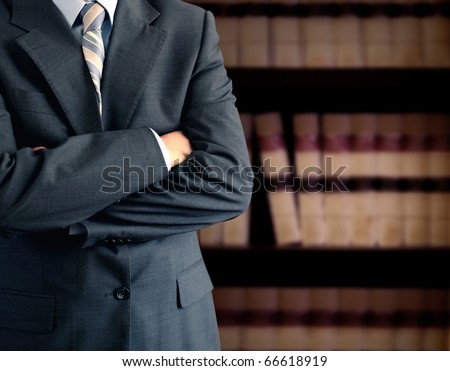 Businessman in front of bookcase