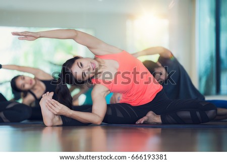   Group of Yoga exercise and class in fitness center, man and lay relax in gym Royalty-Free Stock Photo #666193381