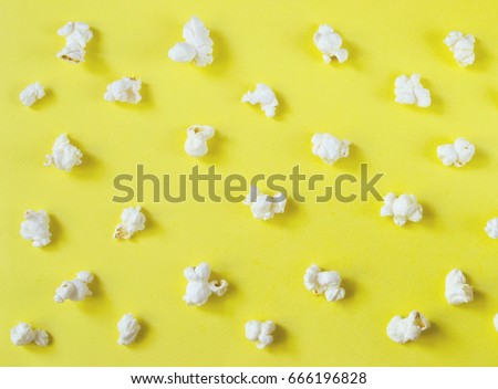 Cinema concept with many fluffy popcorn on yellow retro background