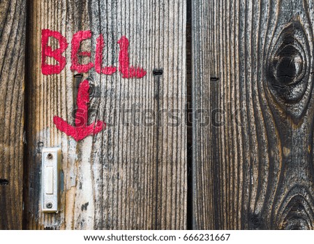 hand painted bell sign with doorbell