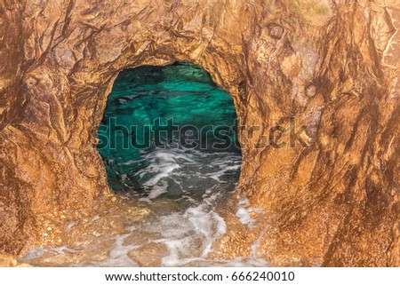 The grotto in the sea-rock during the summer day Sea grotto