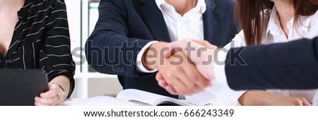 Greup business people shake hands as hello in office closeup. Friend welcome, introduction, greet or thanks gesture, product advertisement, partnership approval, arm, strike a bargain on deal concept