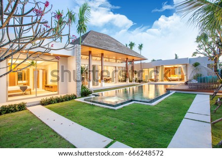 luxury exterior design pool villa with interior design living room  home, house, building , resort , hotel Royalty-Free Stock Photo #666248572