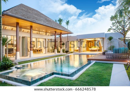 real estate luxury exterior design pool villa with interior design living room  home, house ,sun bed Royalty-Free Stock Photo #666248578