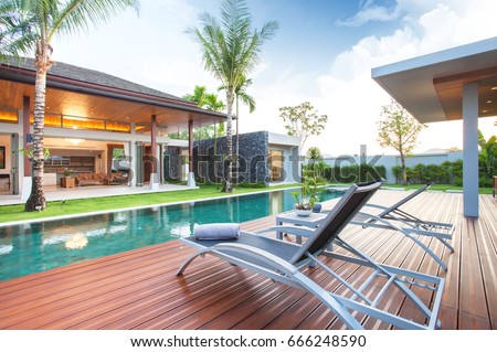luxury exterior design pool villa with interior design living room  home, house, building , resort , hotel Royalty-Free Stock Photo #666248590