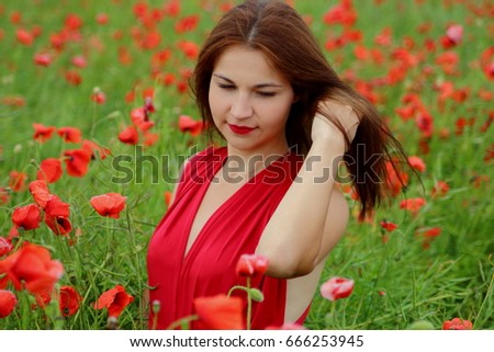 a young girl in a poppy red dress