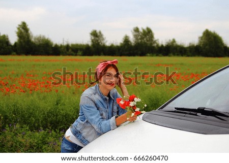 girl in a poppy with a white car and a bouquet of flowers
