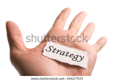 Strategy word in hand, word on piece tear paper