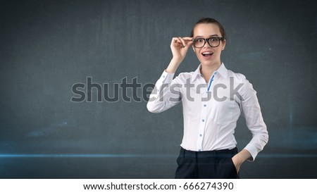 Happy smiling business woman portrait in white skirt on isolated background with copyspace looking at something.