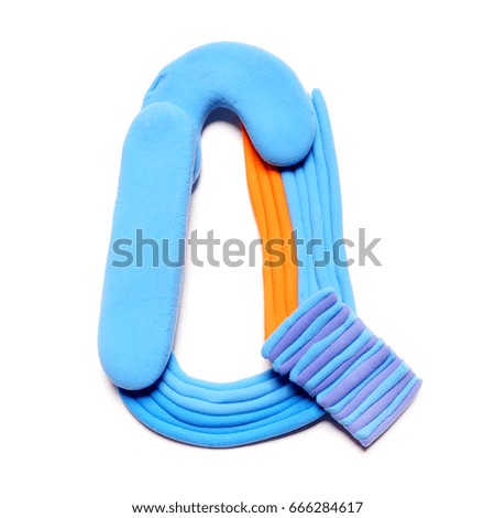 Plasticine letter Q. Color plasticine alphabet, isolated. Small blue and orange color of the alphabet