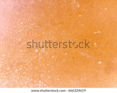 Old orange ceramic tile floor texture