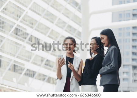 Happy female friends taking selfie at meeting outdoors in the city