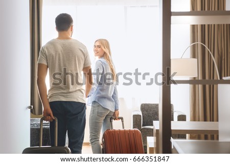Young couple travel together hotel room leisure Royalty-Free Stock Photo #666351847