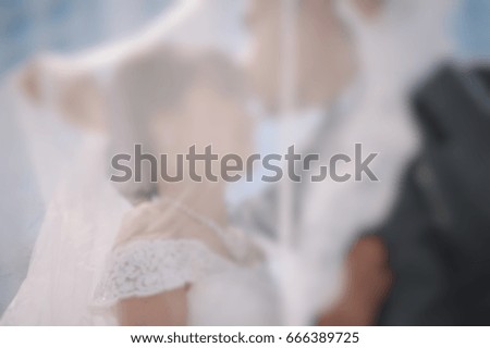 Picture blur of sweet kiss Bride and groom at the wedding.