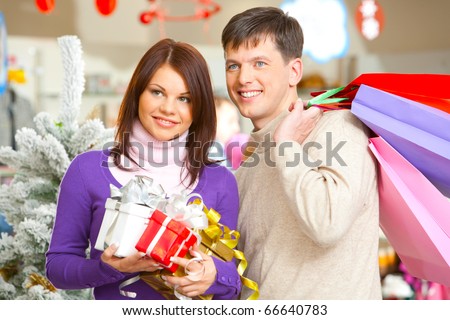 Portrait of husband and wife during shopping before Christmas