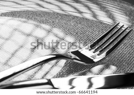 Photo of fork and knife on a plate