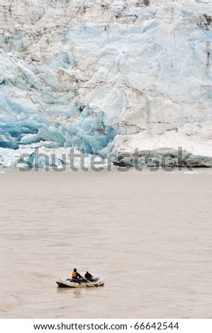 big glacier and small raft