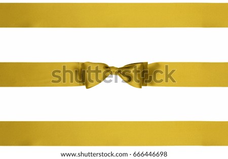Three satin ribbons tied a gold bow