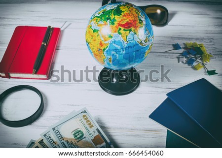Globe and  travel accessories on the table