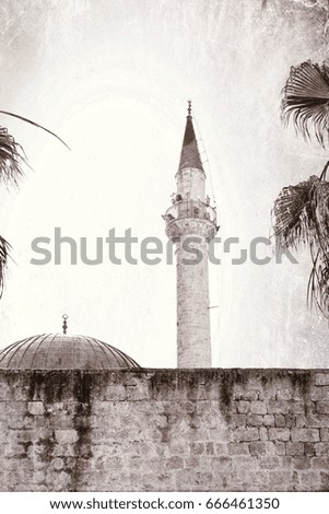 Sinan Pasha Mosque with dome in the old town of Acre, Israel. Muslim mosque and minaret in the old city of Akko. Vintage style toned picture