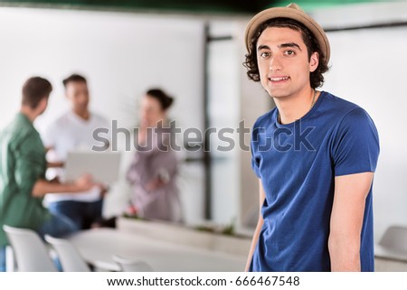 Confident male worker expressing positive emotions