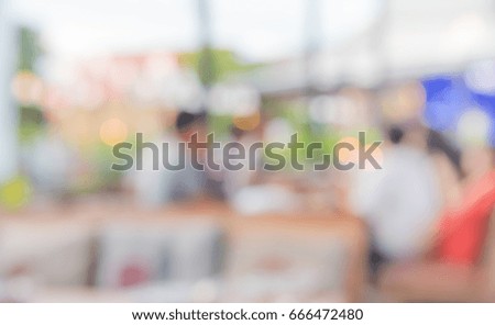 image of blur restaurant or coffee shop on day time with bokeh for background usage .