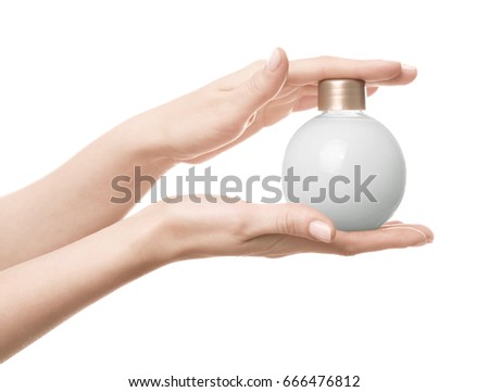 Female hands with bottle of cream for using after shower, on white background