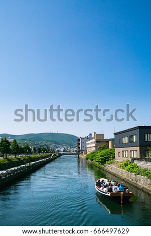 Otaru canal and warehouse district with blue sky in Otaru City, Hokkaido, Japan