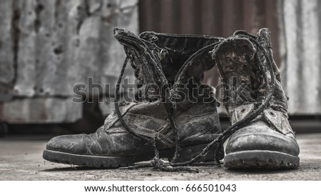 Military footwear that has been used heavily.